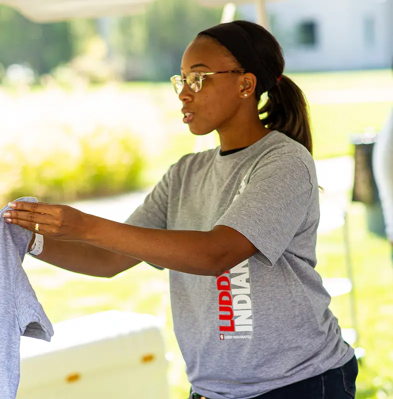 Passing out tshirts at lawn party